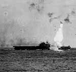 The Big E's Number One elevator is blasted skyward by a Kamikaze hit, May 14, 1945.