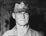 Admiral Marc Mitscher, aboard Enterprise shortly after his transfer from Bunker Hill, 11 May 1945.