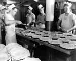 Bakers in Enterprise CV-6 prepare fresh pies for the crew's enjoyment.