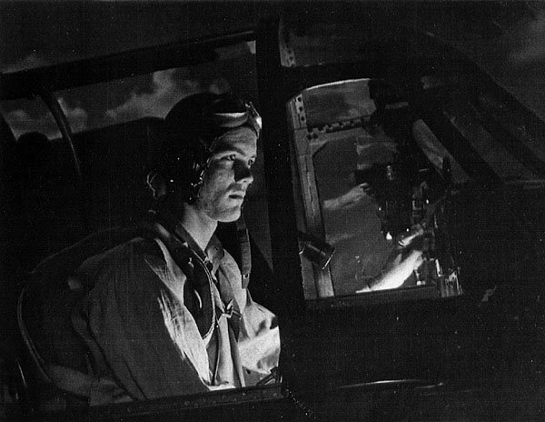 Torpedo 90 pilot, LT(jg) William L. Cromley, in plane, January 1945.