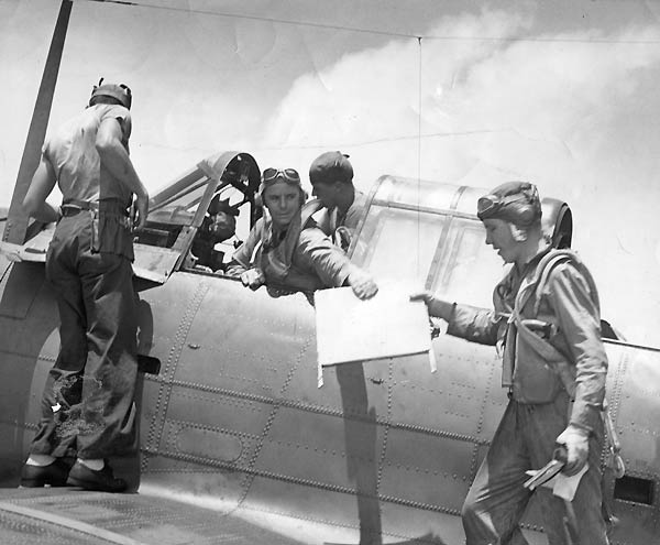 VB-10's LT Oliver W. Hubbard and Radioman Jack Glass prepare for a mission against Truk Atoll.