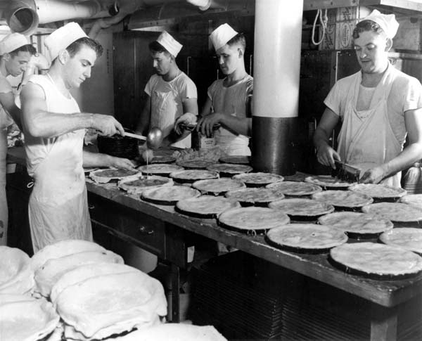 Bakers in Enterprise CV-6 prepare fresh pies for the crew's enjoyment.