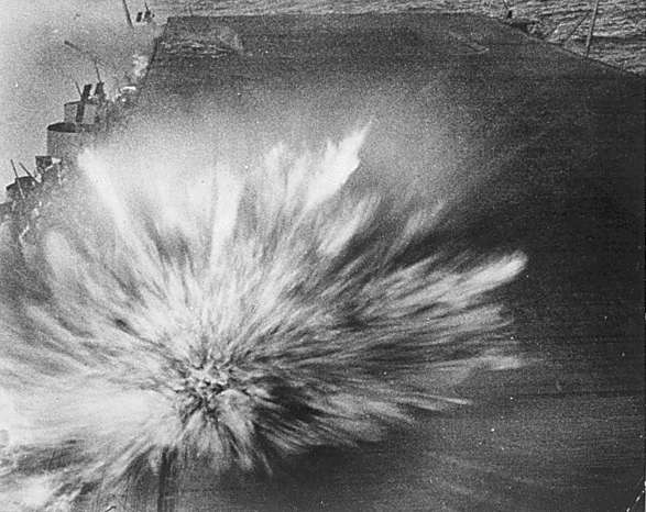 Blast of the third bomb to hit Enterprise CV-6 in two minutes, 24 August 1942.